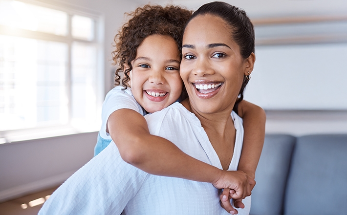 Smiling and happy mother and daughter.