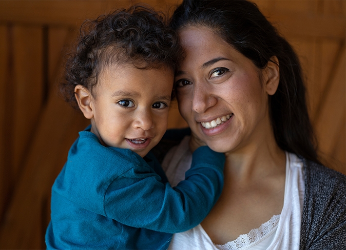 A smiling mother and child.