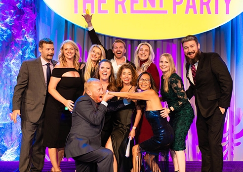 A group photo of partiers at The Rent Party.