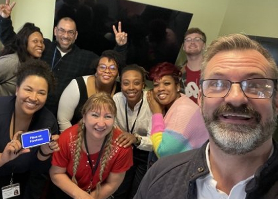 The staff poses for a selfie