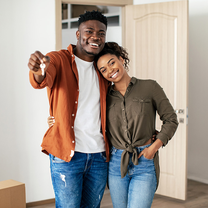 A happy couple get the keys to their new home